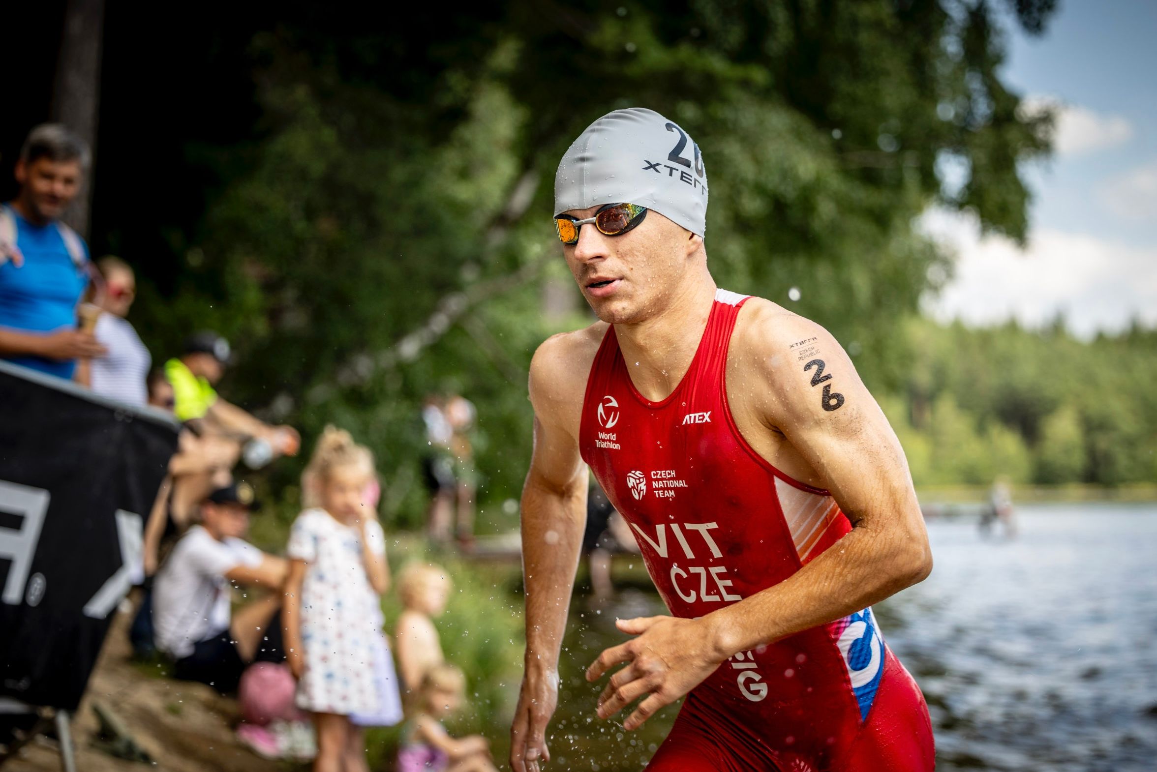 Ondřej Vít running out of the water at a race
